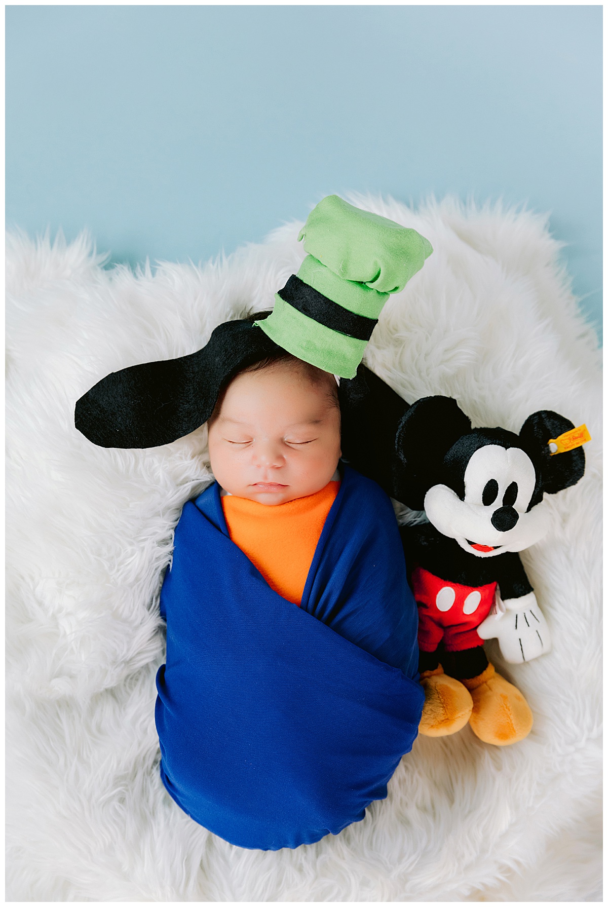 The Perfect Age for Newborn Photos: What You Need to Know - Disney Newborn Photography ideas and inspiration by White Rabbit Photo Boutique. This little one's Disney-loving family wanted portraits as Goofy, with a few other special magical touches.