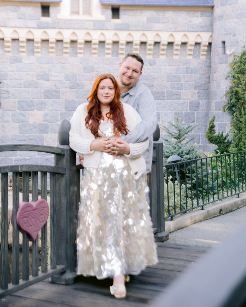 Engaged couple posing together during a Disneyland photo session