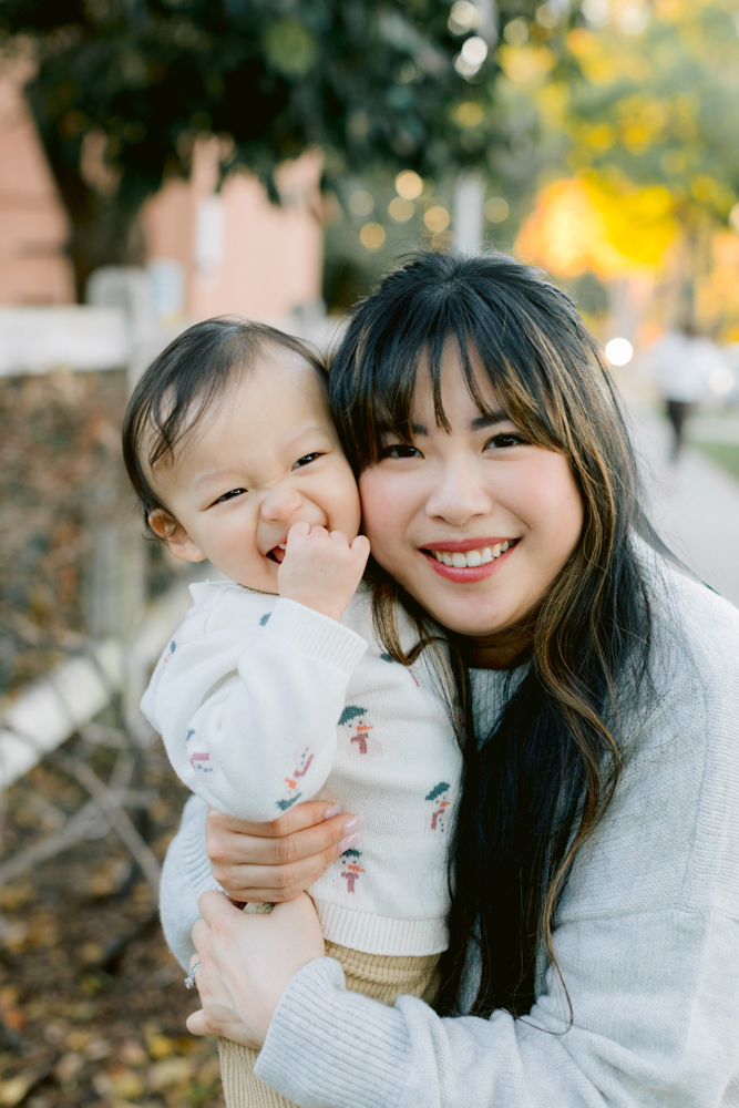 Family laughing together during a holiday mini session in Orange County