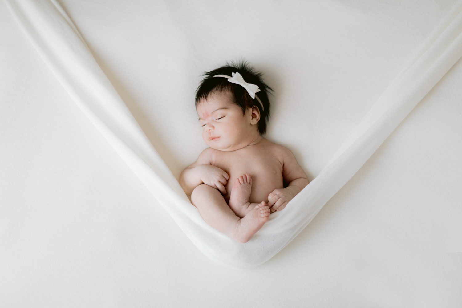 newborn photos taken in Santa Ana, California in the OC at our photography studio