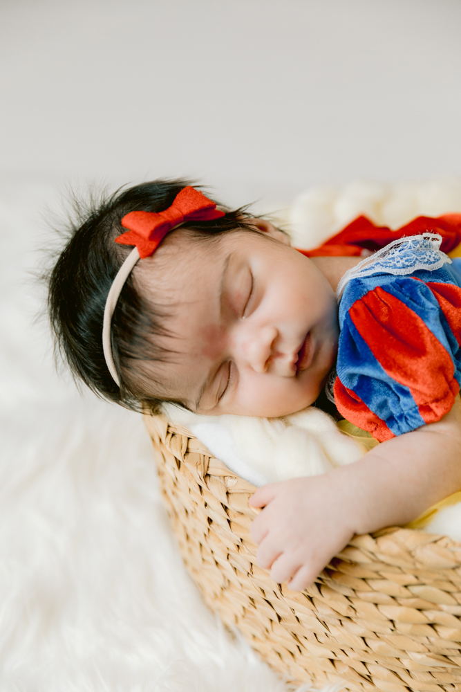 Snow White inspired newborn setup at our Santa Ana Photography Studio