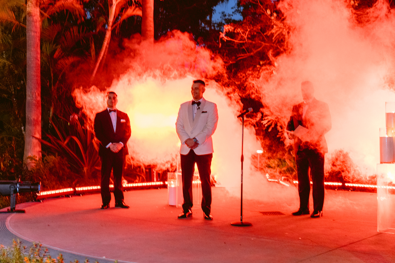 Stylish wedding portraits at the Disneyland Hotel on the Adventure Lawn with a James Bond theme and dramatic lighting