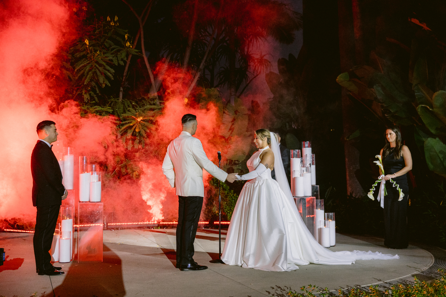 Stylish wedding portraits at the Disneyland Hotel on the Adventure Lawn with a James Bond theme and dramatic lighting