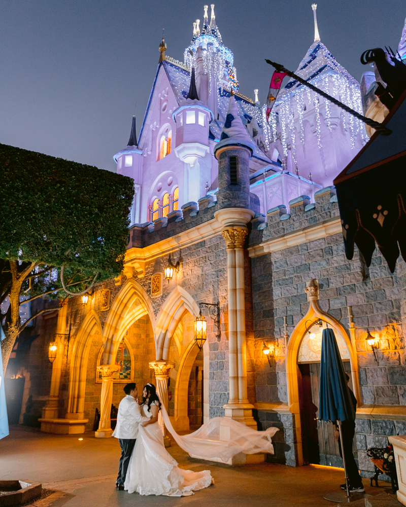 Christmas-themed Disney Wedding portrait session at Sleeping Beauty Castle